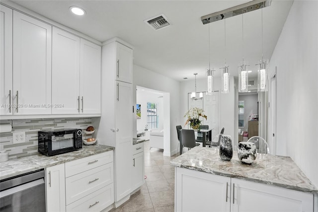 kitchen with pendant lighting and white cabinetry