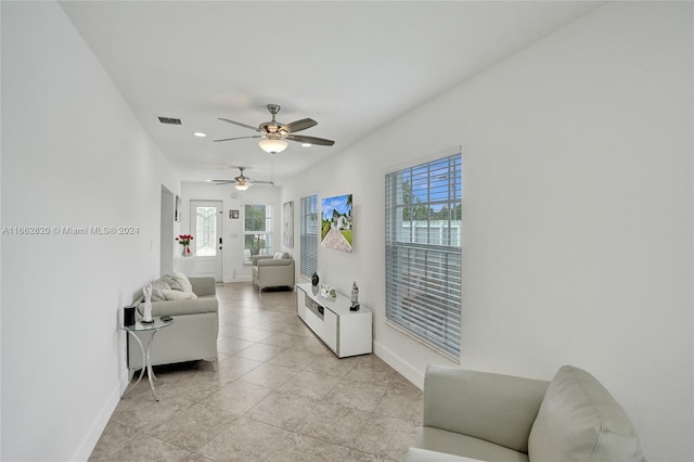 living room featuring ceiling fan