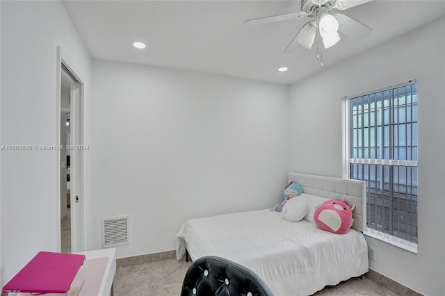 carpeted bedroom with ceiling fan