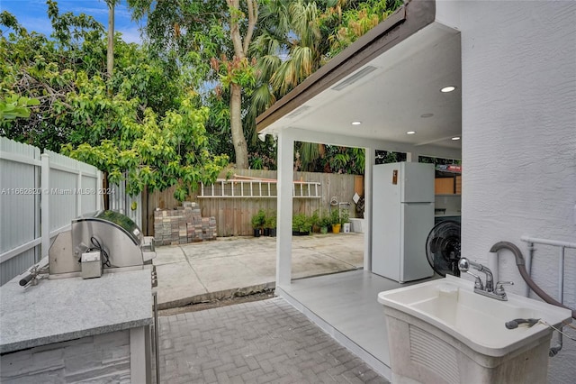 view of patio / terrace with sink