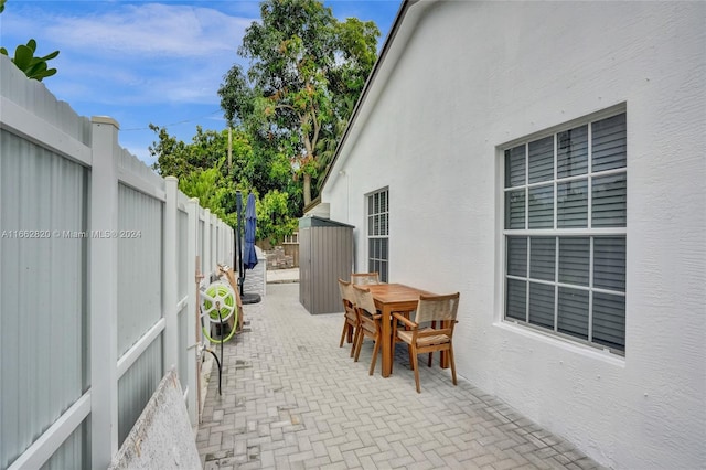 view of patio with a shed