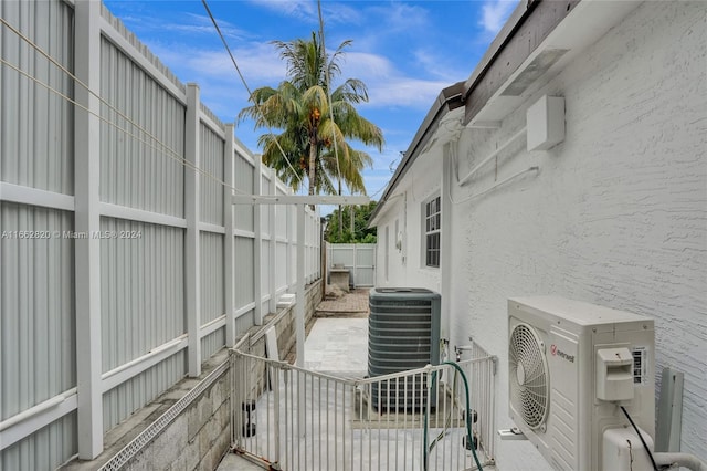 exterior space with ac unit, a patio, and central AC