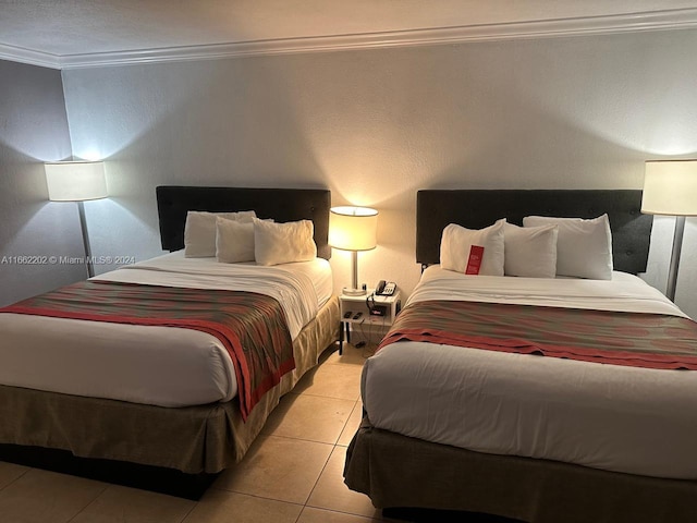 tiled bedroom featuring crown molding