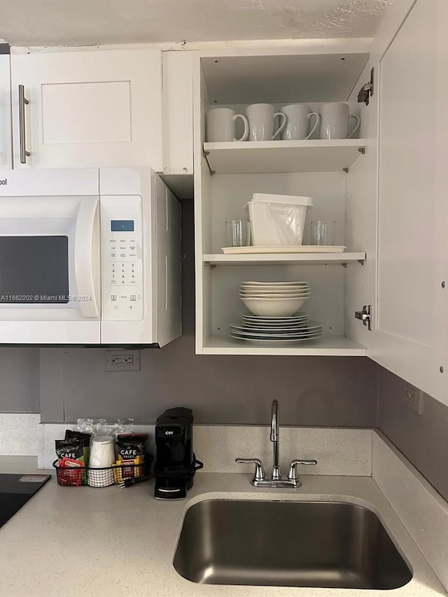 kitchen with sink and white cabinets