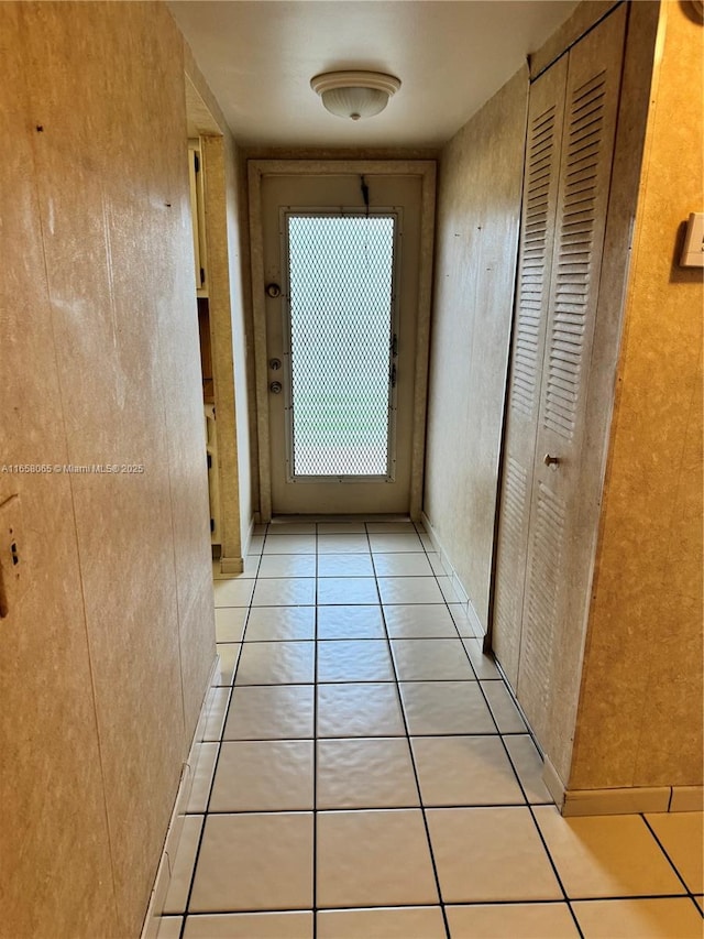 hall featuring light tile patterned flooring