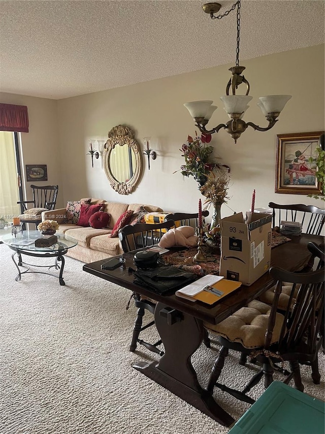 dining room with a textured ceiling and carpet flooring