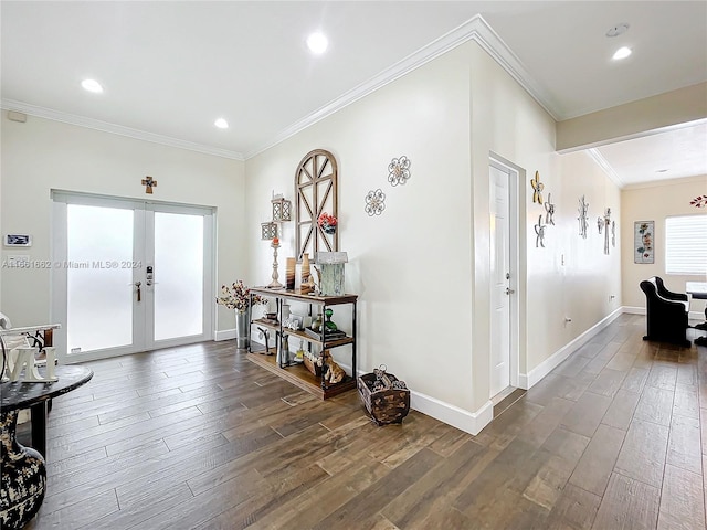 foyer featuring french doors, crown molding, and dark hardwood / wood-style flooring