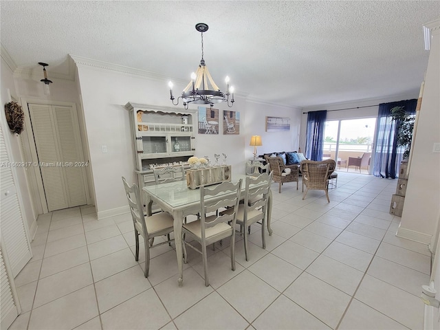1980 S Ocean Dr Unit 2C, Hallandale Beach, FL 33009 - dining area with a chandelier, light tile patterned floors, a textured ceiling, and ornamental molding