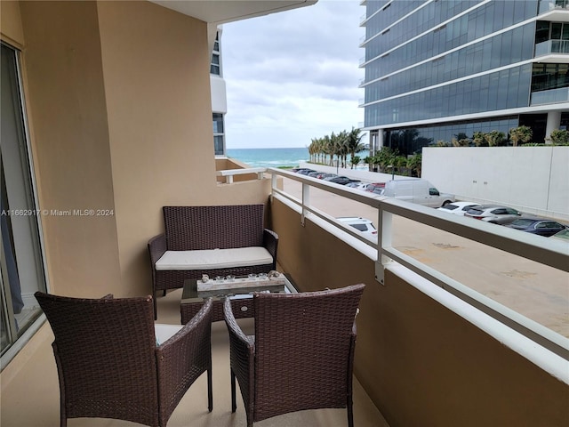 balcony featuring a water view