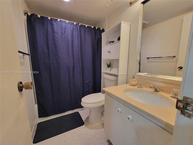 bathroom with a shower with shower curtain, tile patterned flooring, vanity, and toilet