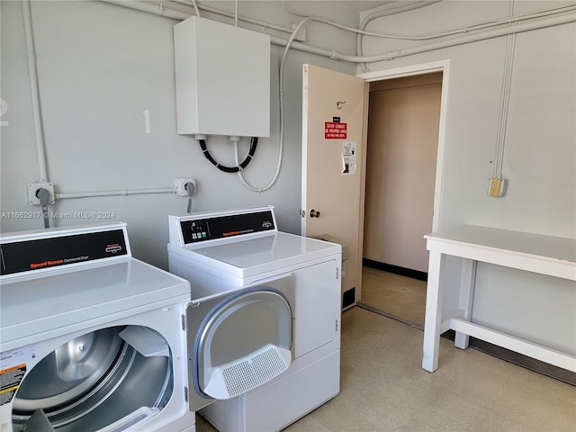 washroom with independent washer and dryer