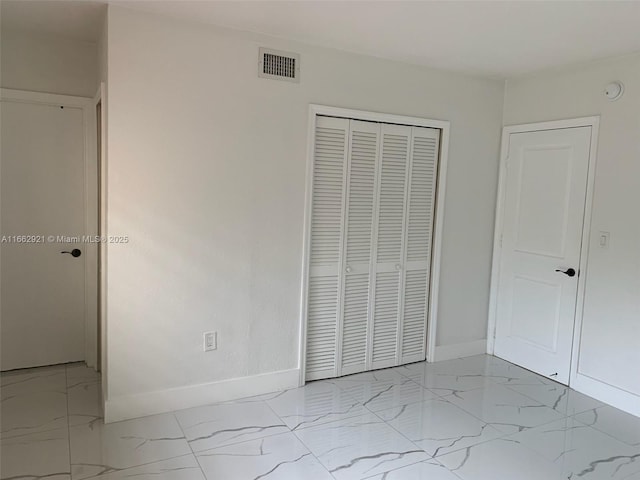 unfurnished bedroom with a closet