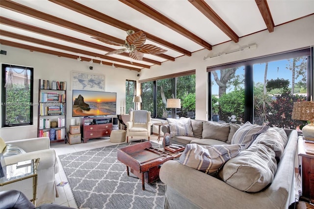 living room with light tile patterned floors, beam ceiling, and ceiling fan