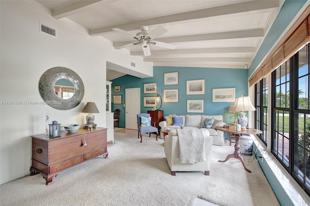 carpeted living room featuring lofted ceiling with beams and ceiling fan