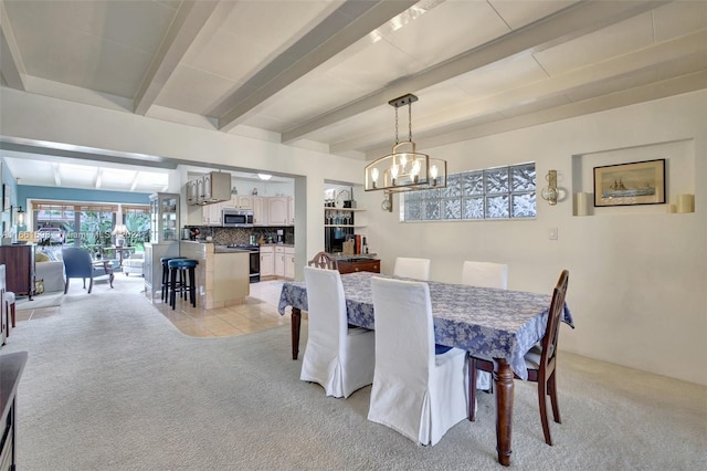 dining space featuring beamed ceiling, light carpet, and a chandelier