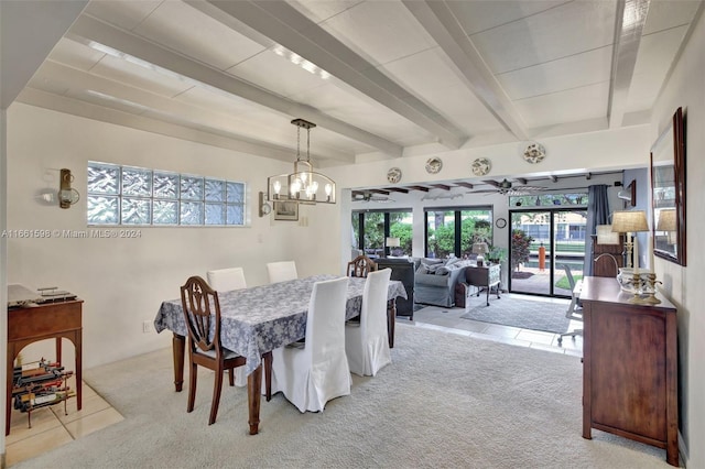 dining area with light colored carpet, beamed ceiling, and ceiling fan with notable chandelier