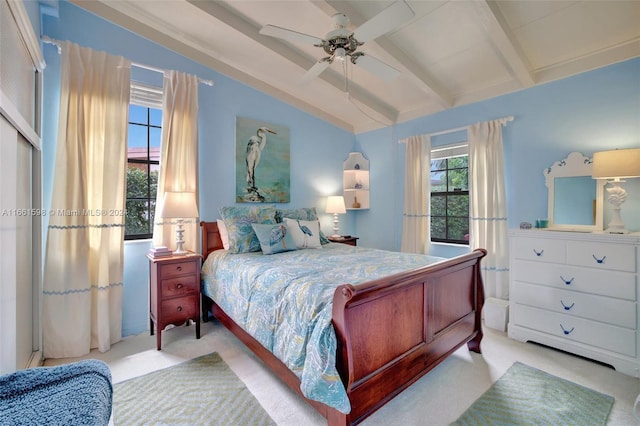 bedroom featuring ceiling fan, light carpet, and beam ceiling