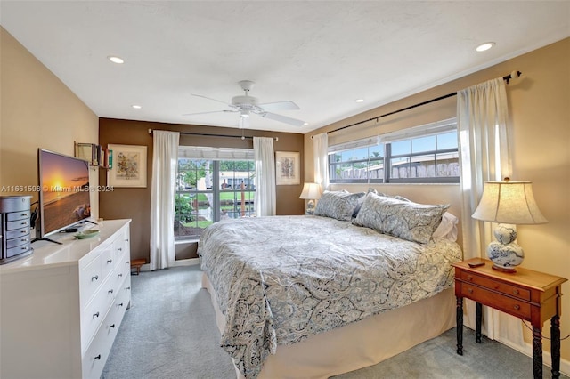 carpeted bedroom with ceiling fan