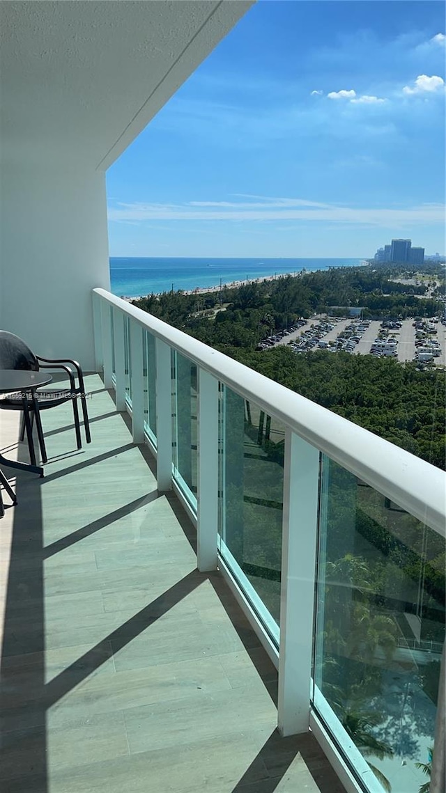 balcony featuring a water view