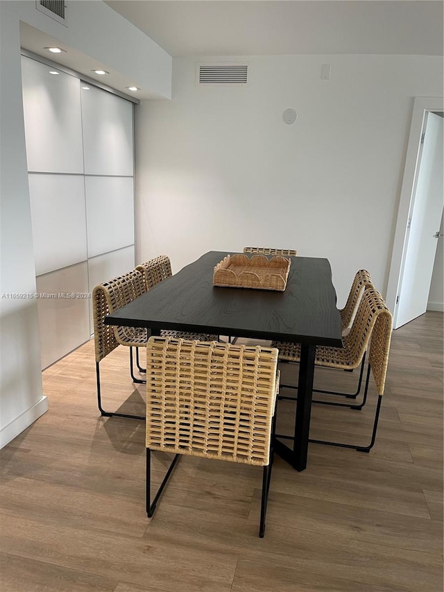 dining space featuring hardwood / wood-style floors