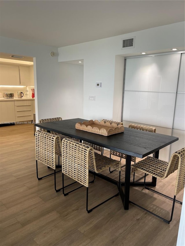 dining room featuring hardwood / wood-style flooring