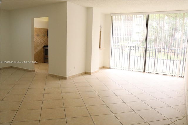 spare room with light tile patterned floors