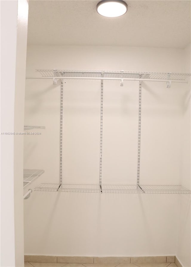 16919 N Bay Rd Unit 118, Sunny Isles Beach, FL 33160 - walk in closet with tile patterned flooring