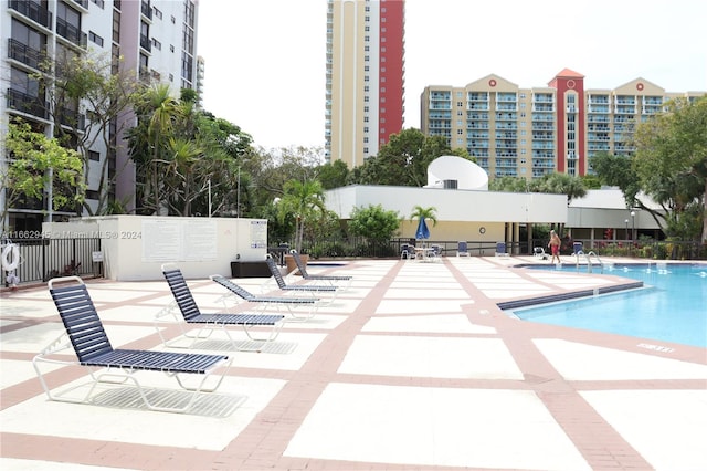 view of swimming pool with a patio area