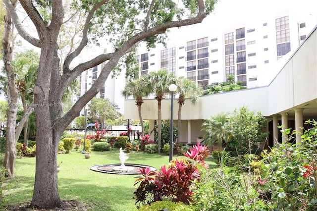 view of home's community with a lawn