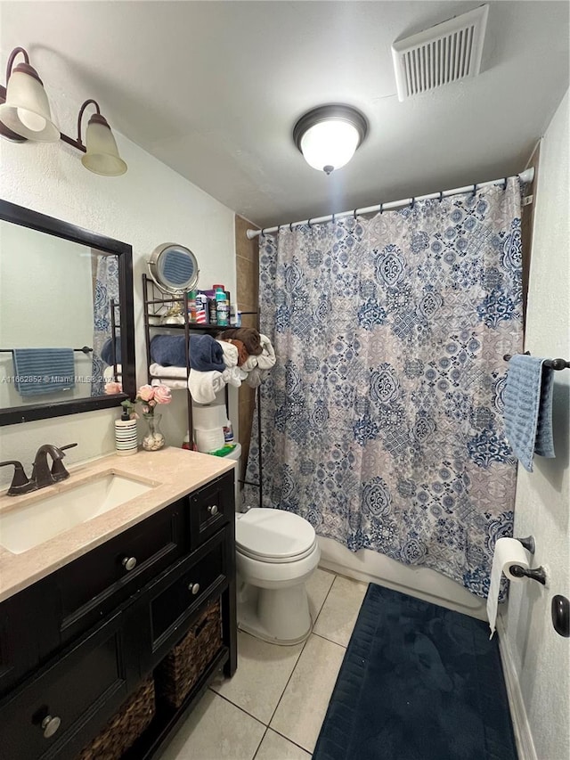 full bathroom featuring shower / bathtub combination with curtain, tile patterned floors, vanity, and toilet