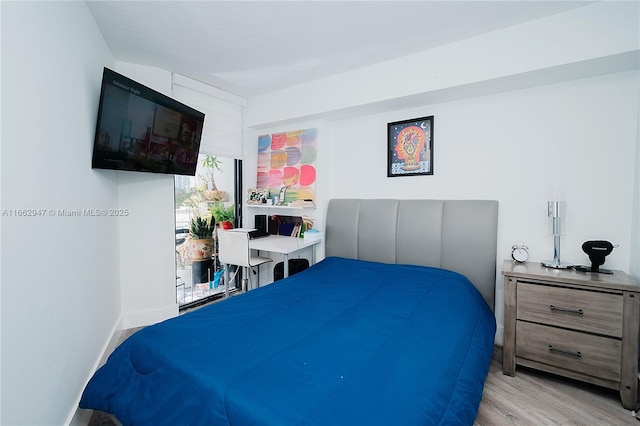 bedroom featuring light wood-type flooring