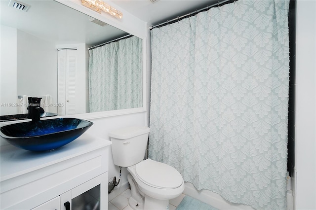 bathroom with vanity, a shower with curtain, and toilet