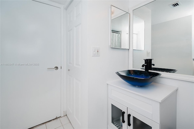 bathroom with vanity and tile patterned floors