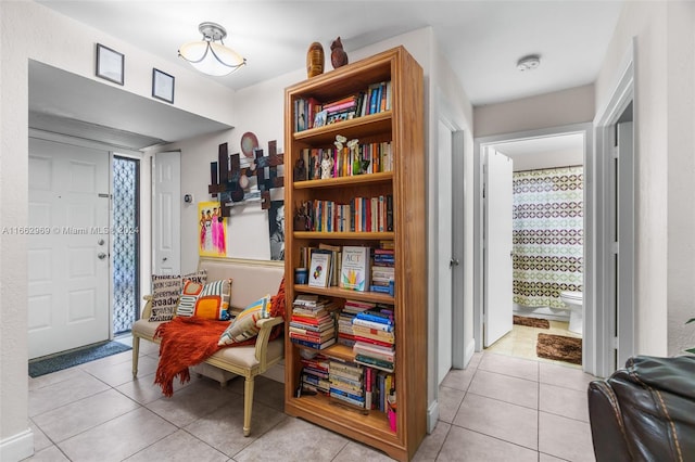 sitting room featuring light tile patterned flooring