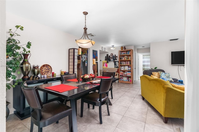 dining area with light tile patterned floors