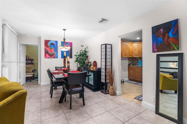 dining space featuring light tile patterned floors