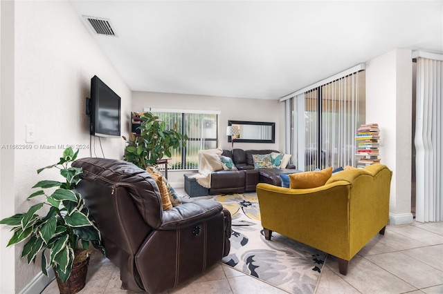 living room featuring light tile patterned floors and a wealth of natural light