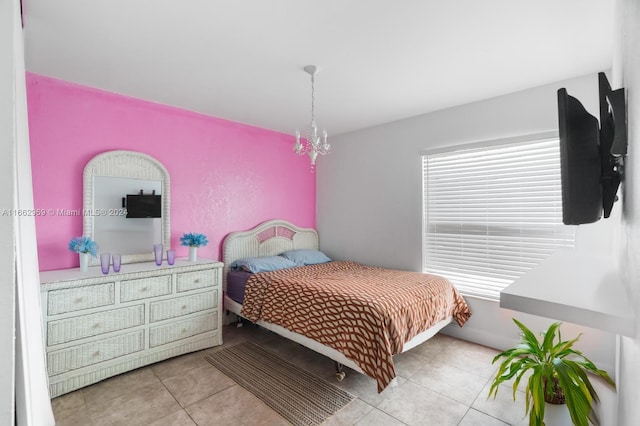 bedroom with light tile patterned floors