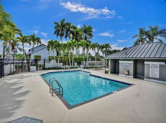 view of swimming pool featuring a patio area