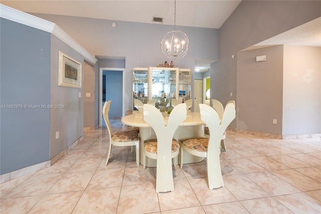 tiled dining area featuring crown molding and a notable chandelier