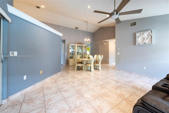 tiled dining space featuring ceiling fan with notable chandelier, vaulted ceiling, and a textured ceiling