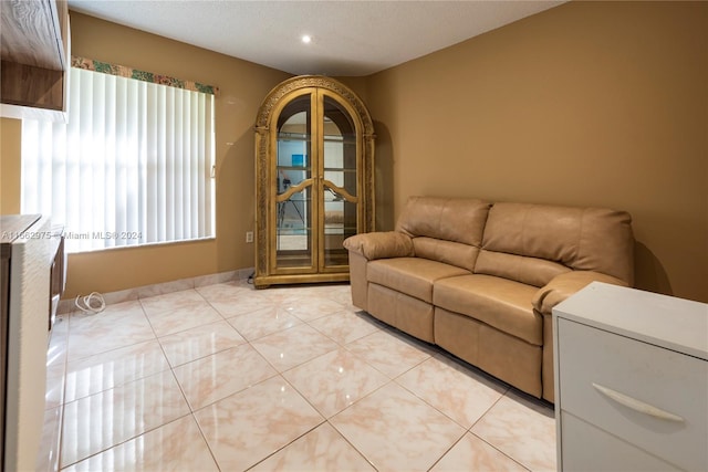 living room with light tile patterned flooring