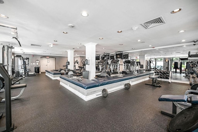 workout area featuring ornate columns, visible vents, and recessed lighting