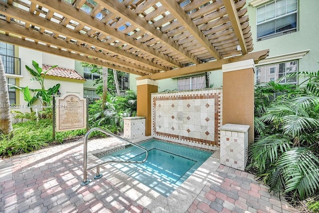 view of swimming pool featuring a patio and a pergola