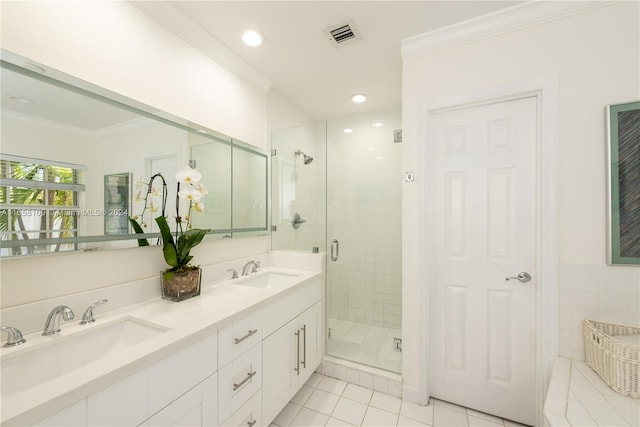 bathroom featuring crown molding, vanity, tile patterned floors, and a shower with shower door