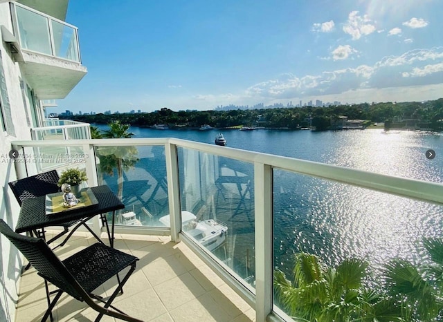 balcony featuring a water view