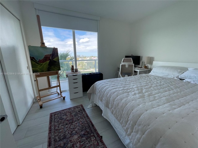 bedroom with a wall of windows