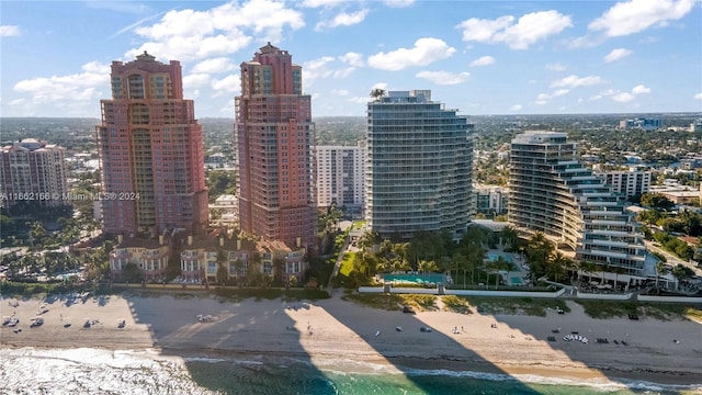 property's view of city with a water view and a beach view