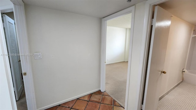 corridor with tile patterned flooring