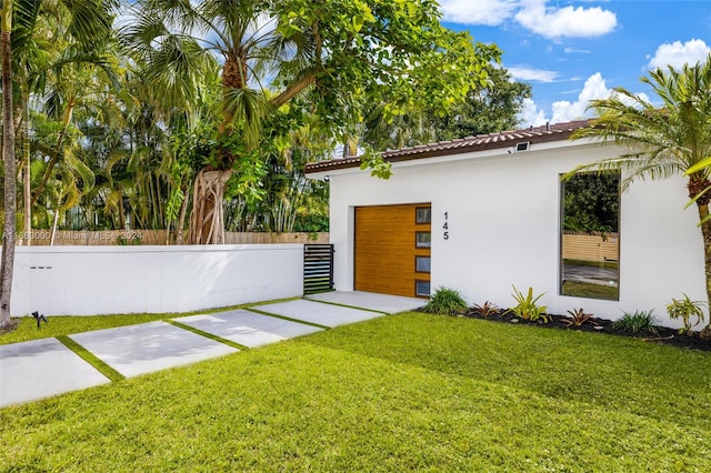 view of yard with a garage